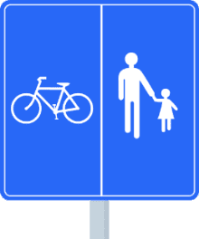 Signal de chemin réservé avec parties désignées : cyclistes d'un côté, piétons de l'autre